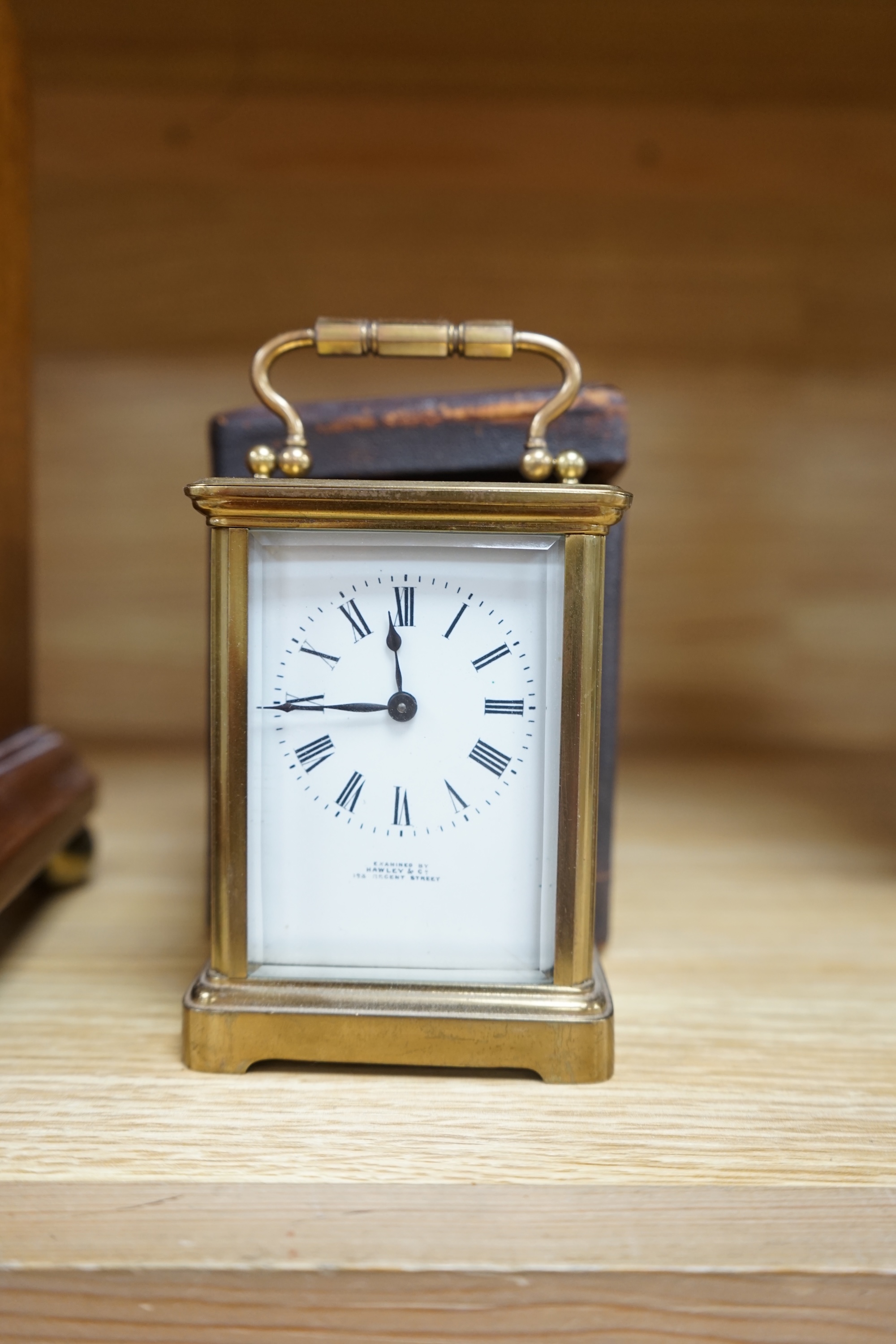 A cased brass carriage timepiece and a dome topped Edwardian mantel clock striking on a coiled gong, backplate stamped BTG, 29.5cm (2) Condition - fair to good.